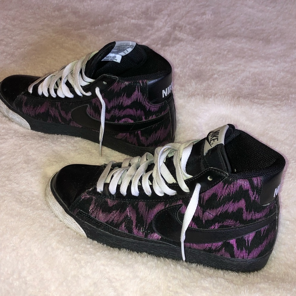 Nike high tops with purple and black zebra stripes
